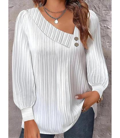 Blusa feminina plissada com botões no ombro, design elegante, mangas bufantes e decote assimétrico, ideal para looks sofisticados. Blusa feminina plissada com botões no ombro, design elegante, mangas bufantes e decote assimétrico, ideal para looks sofisticados.
