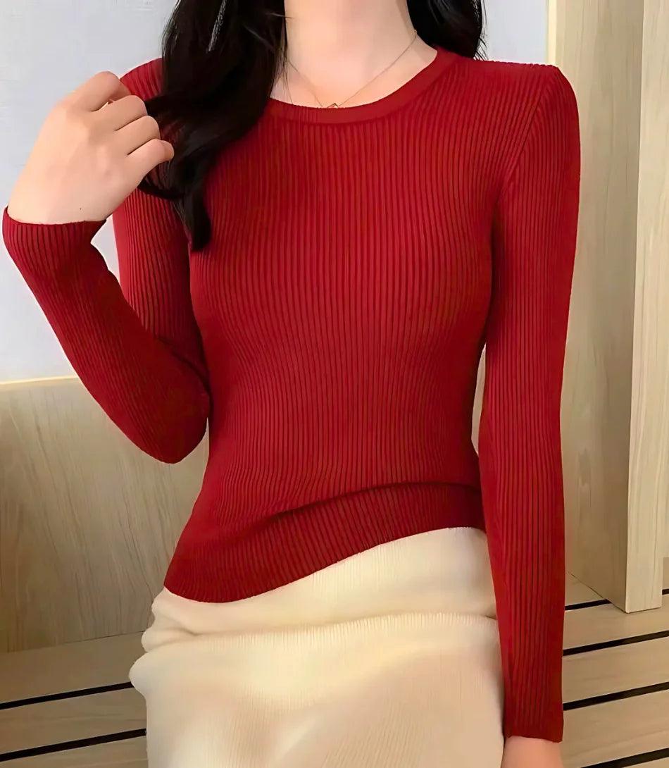 Blusa feminina de tricot canelado, manga longa, com decote redondo e ajuste confortável. Estilo sofisticado e versátil. Blusa feminina de tricot canelado, manga longa, com decote redondo e ajuste confortável. Estilo sofisticado e versátil.