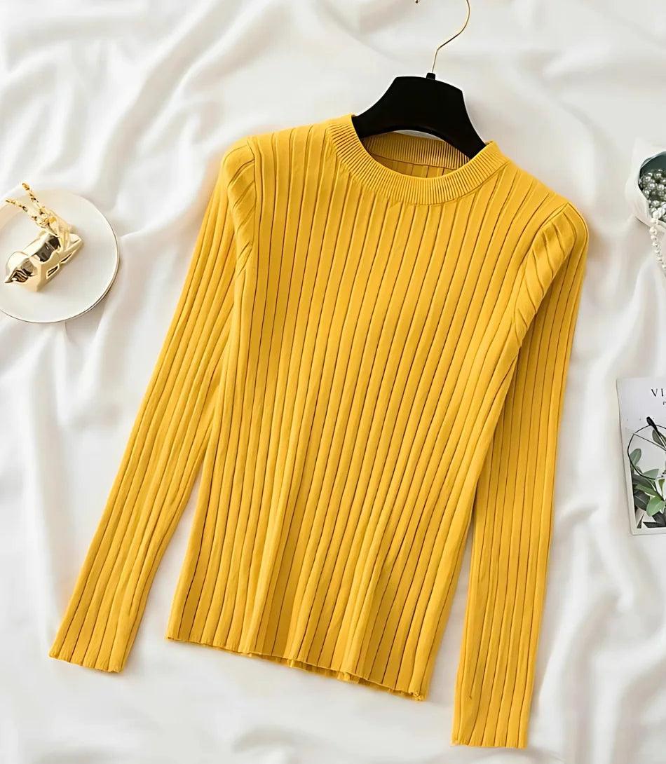 Blusa feminina de tricot canelado, manga longa, com decote redondo e ajuste confortável. Estilo sofisticado e versátil. Blusa feminina de tricot canelado, manga longa, com decote redondo e ajuste confortável. Estilo sofisticado e versátil.