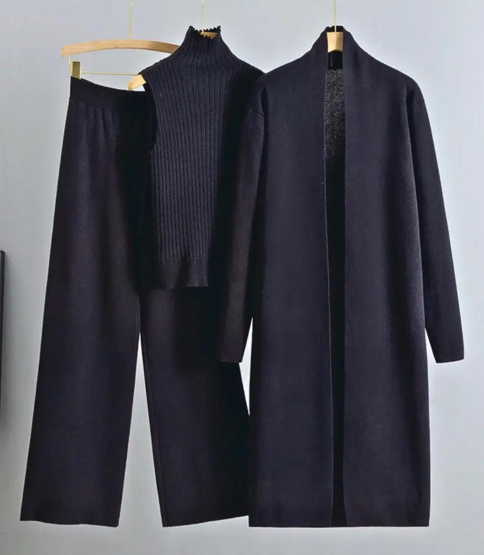 Mulher vestindo Conjunto Comfy Feminino de Lanzinha 3 peças com casaco longo, colete de gola alta e calça de cintura alta, ideal para outono e primavera. - Anellimn Mulher vestindo Conjunto Comfy Feminino de Lanzinha 3 peças com casaco longo, colete de gola alta e calça de cintura alta, ideal para outono e primavera. - Anellimn