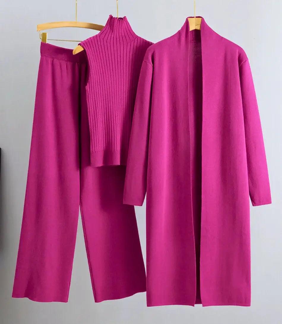 Mulher vestindo Conjunto Comfy Feminino de Lanzinha 3 peças com casaco longo, colete de gola alta e calça de cintura alta, ideal para outono e primavera. - Anellimn Mulher vestindo Conjunto Comfy Feminino de Lanzinha 3 peças com casaco longo, colete de gola alta e calça de cintura alta, ideal para outono e primavera. - Anellimn