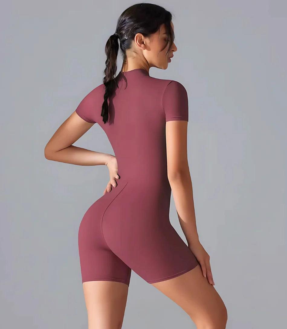 Macaquinho Fitness feminino com mangas longas e zíper frontal, ajuste perfeito para atividades como yoga e musculação. rosa Macaquinho Fitness feminino com mangas longas e zíper frontal, ajuste perfeito para atividades como yoga e musculação. rosa