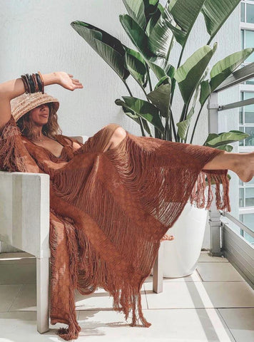 Saída de Praia Longa: O melhor look para suas férias à beira-mar. Saída de Praia Longa: O melhor look para suas férias à beira-mar.