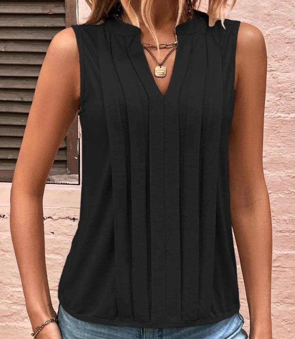 Regata feminina elegante com detalhe plissado, modelo sem mangas em tecido leve, perfeita para composições sofisticadas e casuais. Regata feminina elegante com detalhe plissado, modelo sem mangas em tecido leve, perfeita para composições sofisticadas e casuais.