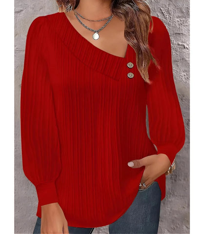 Blusa feminina plissada com botões no ombro, design elegante, mangas bufantes e decote assimétrico, ideal para looks sofisticados.