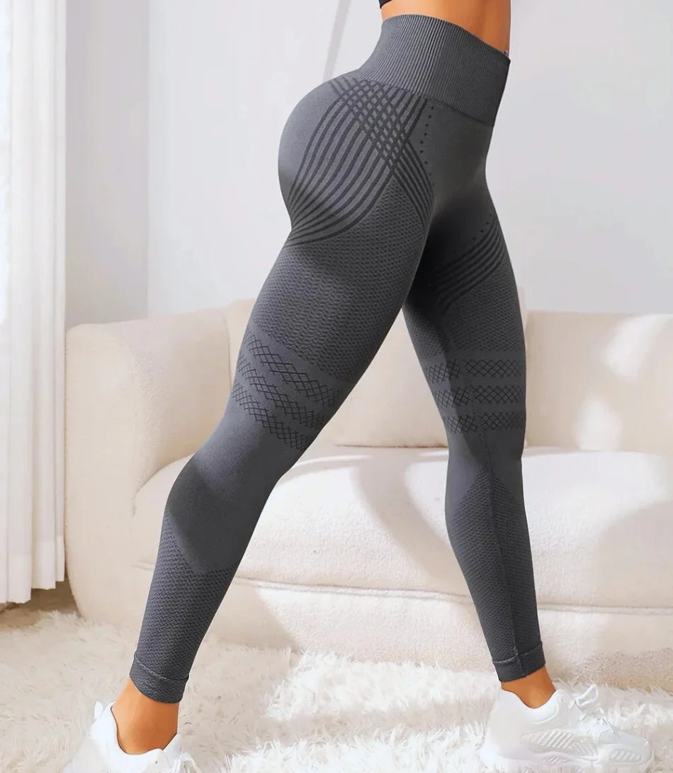 Calça legging modeladora fitness de cintura alta com tecido de compressão médio, design anatômico, sem costura e ajuste perfeito para valorizar a silhueta.