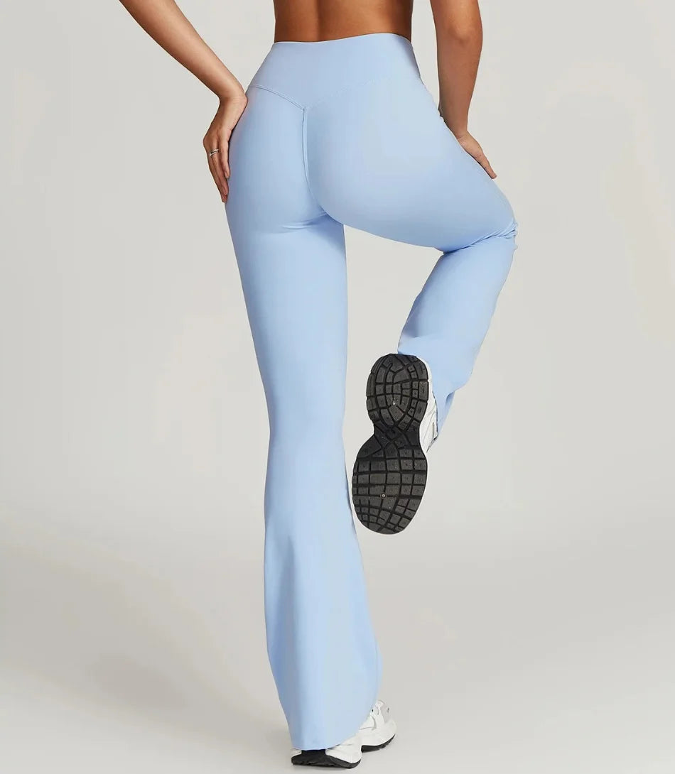 Calça flare cintura alta para academia e yoga, tecido leve e elástico, cós reforçado, ideal para atividades físicas e looks casuais.