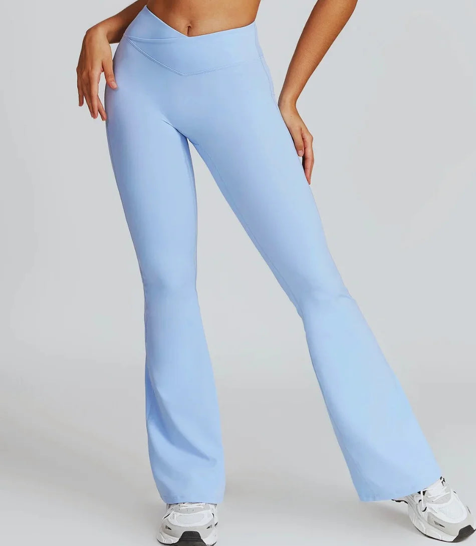 Calça flare cintura alta para academia e yoga, tecido leve e elástico, cós reforçado, ideal para atividades físicas e looks casuais.