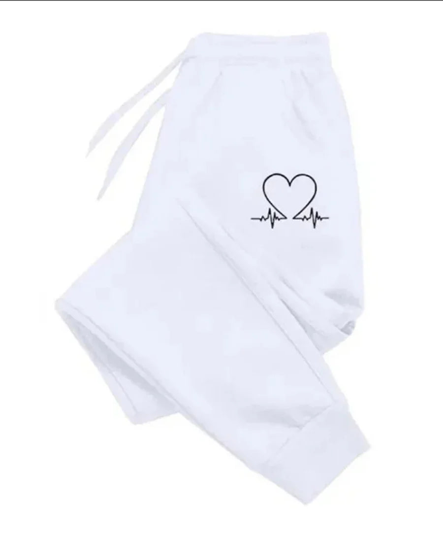 Calça de moletom feminina básica em poliéster respirável, com corte cônico, bolsos com zíper e cós ajustável. Conforto e estilo para todas as ocasiões.