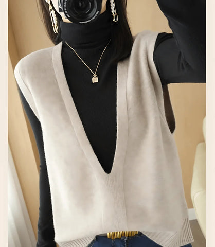Colete feminino de tricot com gola V, estilo básico, ideal para sobreposições em looks formais e casuais, confortável e elegante.