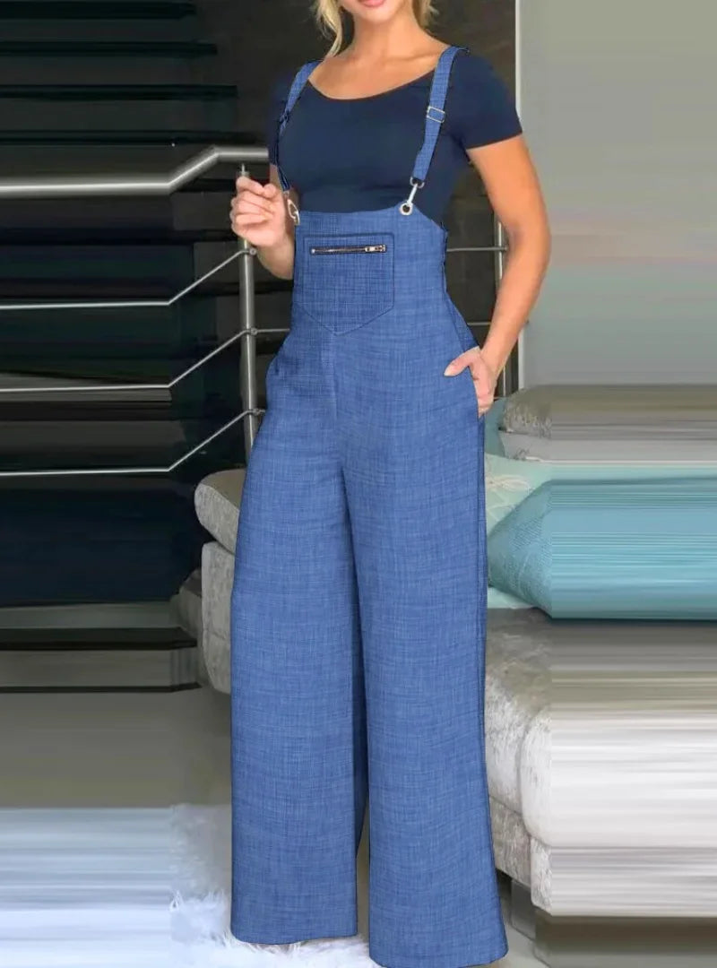 Macacão feminino suspenso em Jean. Estilo casual, pernas largas e ajustáveis. Conforto e elegância em um design moderno.