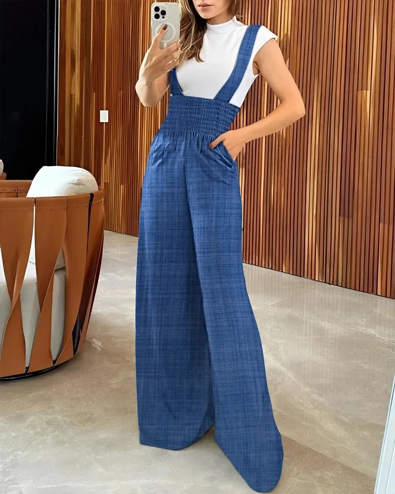 Moda feminina: Suspensório Macacão Jeans, elegância listrada para trabalho e lazer. Confeccionado em 65% algodão, 34% poliéster, 1% elastano