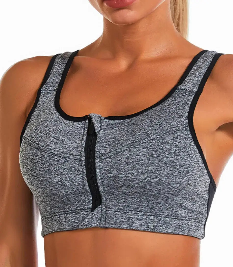 Top esportivo feminino plus size com zíper frontal, fecho ajustável e sustentação, ideal para treinos de alto impacto.