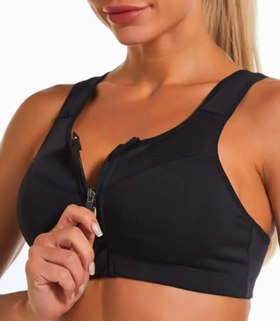 Top esportivo feminino plus size com zíper frontal, fecho ajustável e sustentação, ideal para treinos de alto impacto.