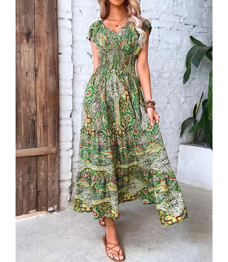 Vestido Boho Chic Longo estampado, com decote em V, mangas amplas e cintura ajustável, perfeito para ocasiões casuais e elegantes.