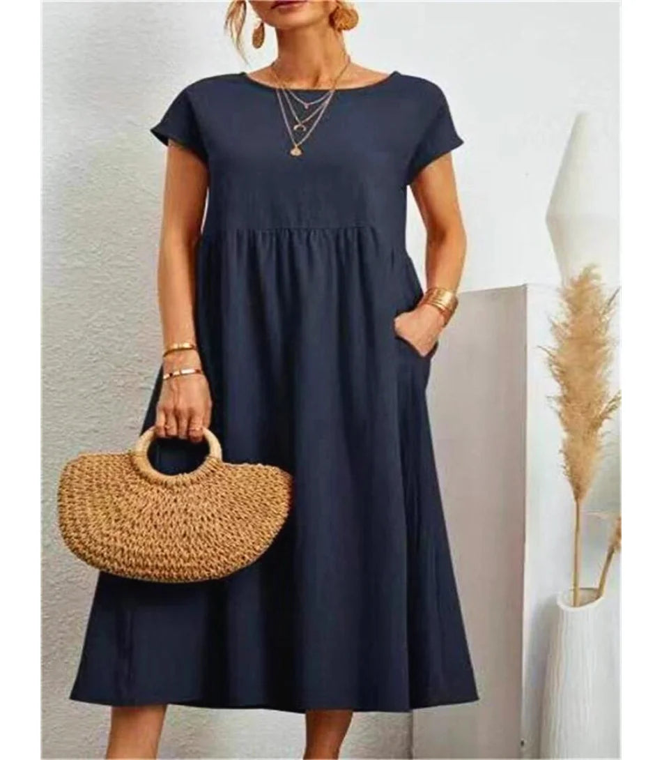 Vestido longo feminino casual em algodão e linho com bolsos laterais e mangas curtas para estilo e conforto.