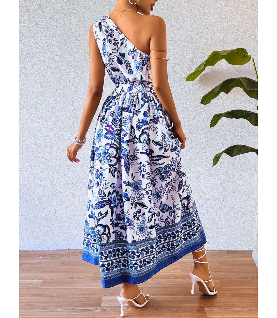 Vestido Midi Boho Floral Um Ombro Feminino com estampa floral, corte midi e ajuste na cintura, perfeito para looks elegantes e versáteis.