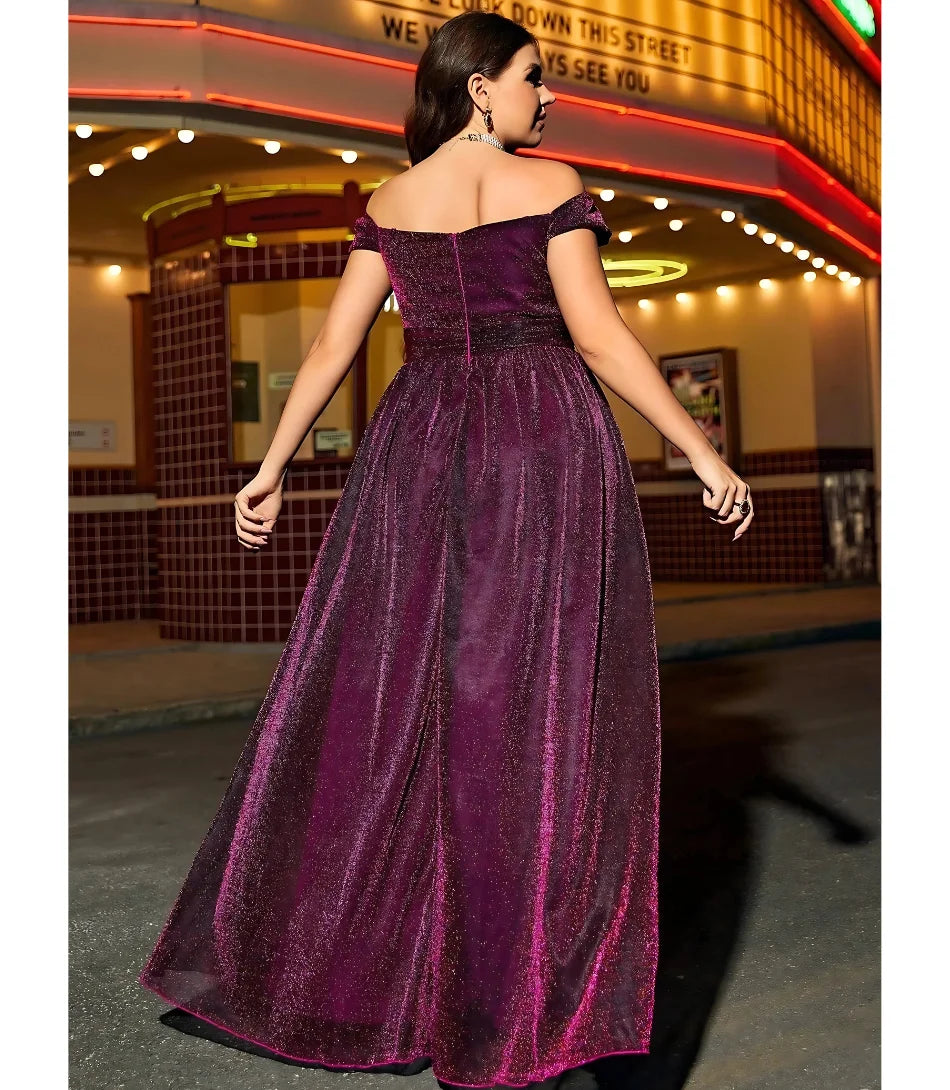 Vestido Longo de Festa Ombro a Ombro com Fenda Brilhante, disponível na loja&nbsp; ideal para ocasiões especiais com glamour e sofisticação.