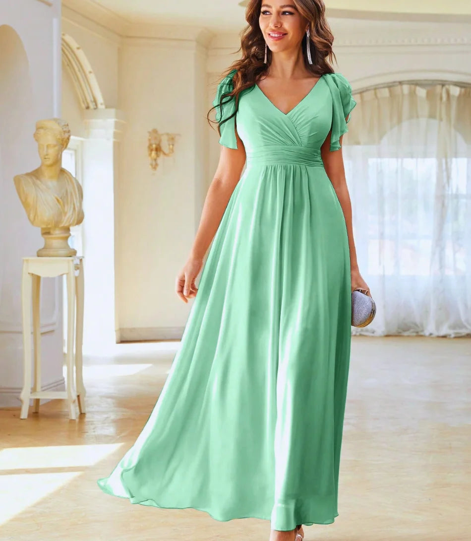 Vestido de festa longo elegante com decote V e mangas delicadas, ideal para eventos formais, em tecido leve e fluido.