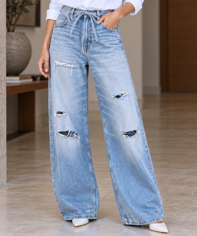 Comprar calça jeans pantalona feminina com amarração na cintura azul claro em promoção Anellimn