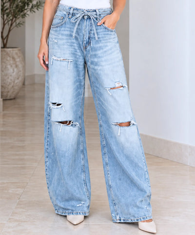 Comprar calça jeans pantalona feminina com rasgos nos joelhos azul claro em promoção Anellimn