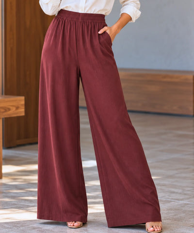 Calça pantalona feminina marrom com cós elástico e bolsos laterais