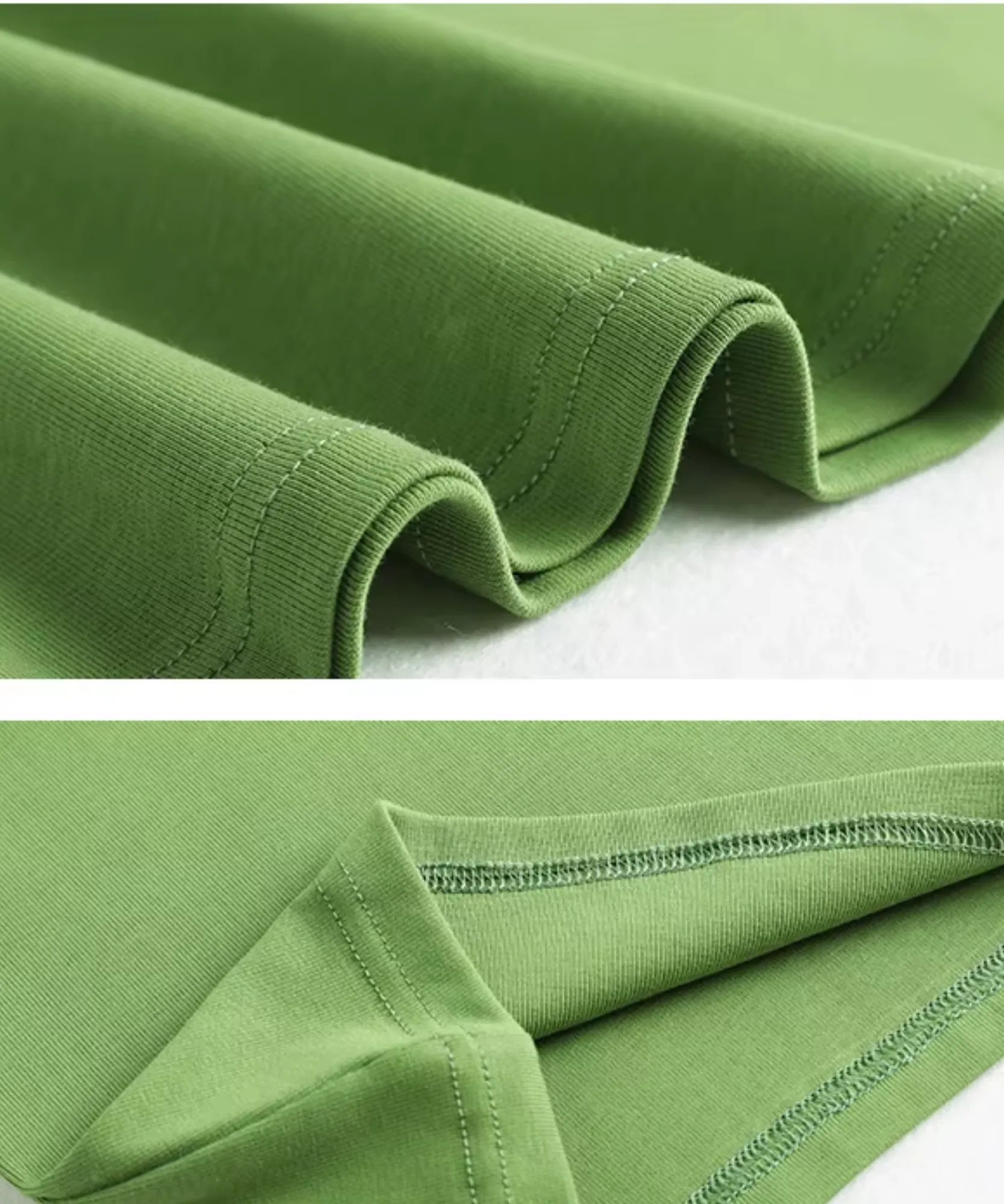Detalhe do tecido 100% algodão dobrado da camiseta feminina manga curta verde, mostrando textura e acabamento