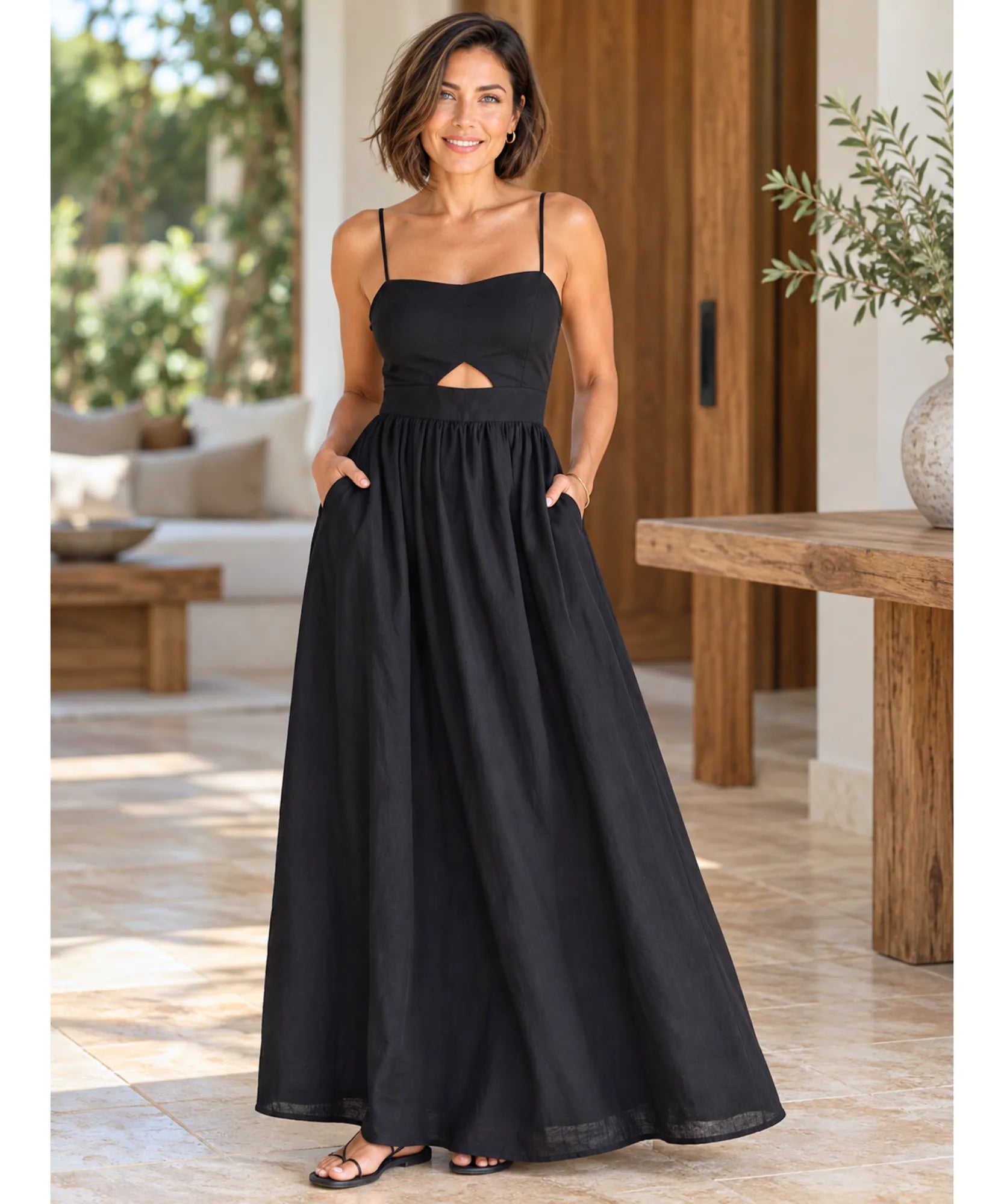 Vestido longo preto elegante, vista de frente com recorte na cintura